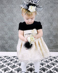 Little girl special at wedding with hat and shoe-look tights