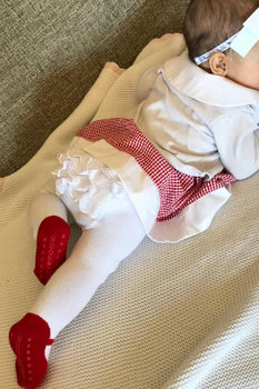 Infant girl wears Baby Emporio white footed leggings tights with red shoe look size 0-6 months