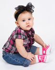 Little girl wearing tennis sneaker looking socks with non-slip gripper soles and faux shoelaces