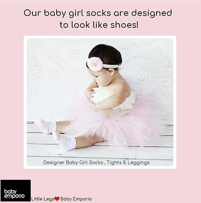 Baby model with pink baby girl socks by Baby Emporio