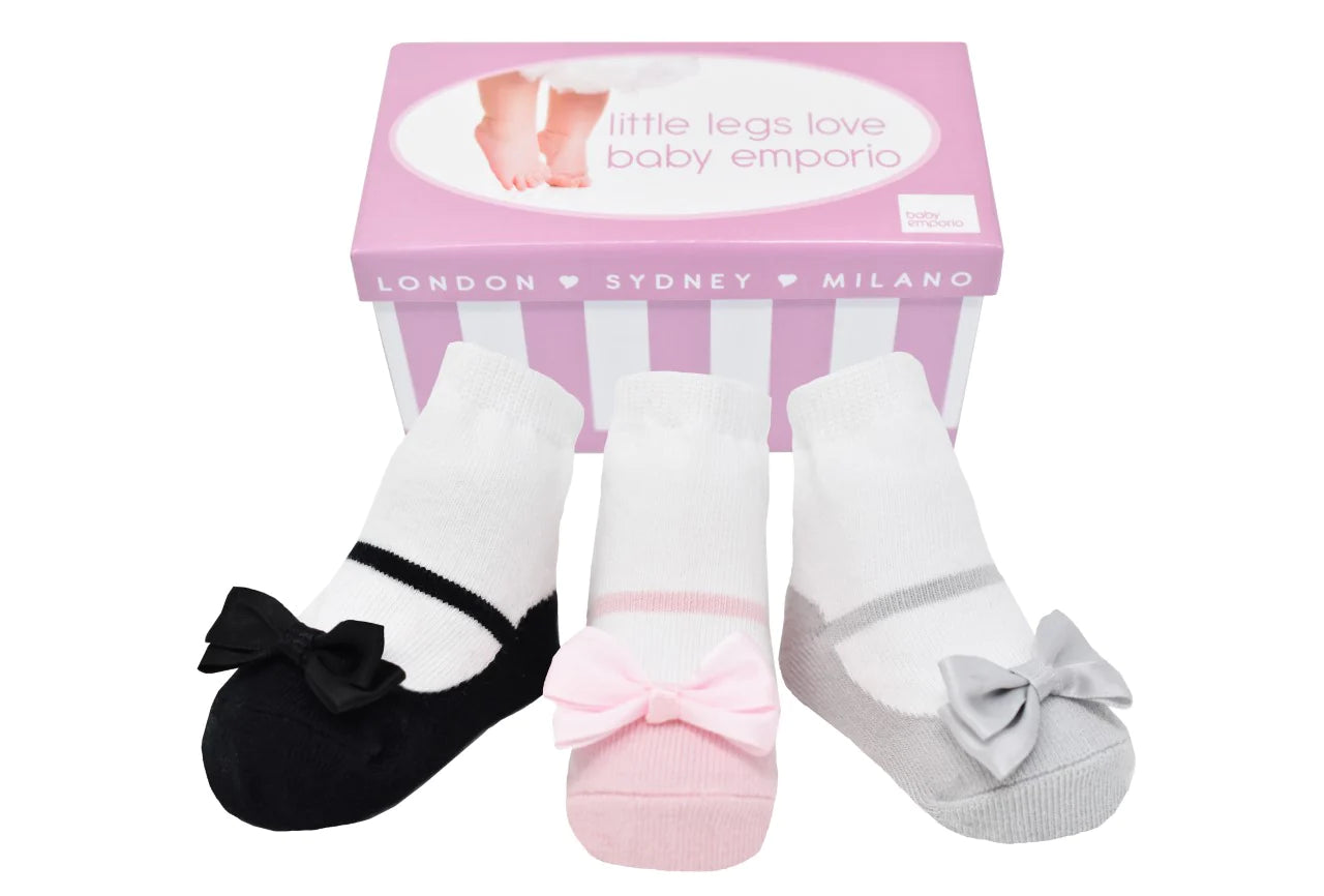A box of Mary Jane shoe-look baby girl socks in pink, black and silver