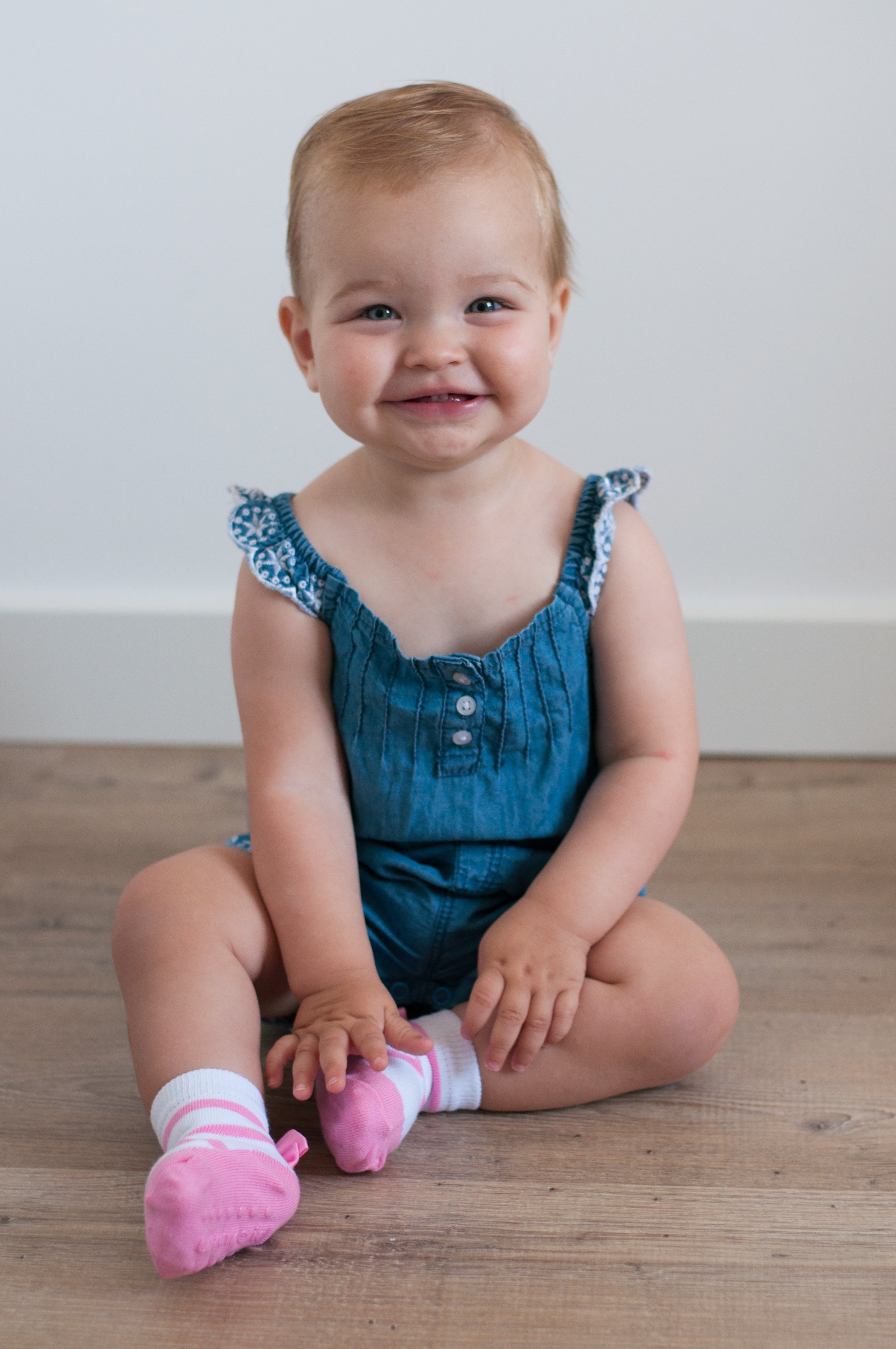 Baby girl wears pink ballet socks by Baby Emporio size 0-12 months with anti-slip soles