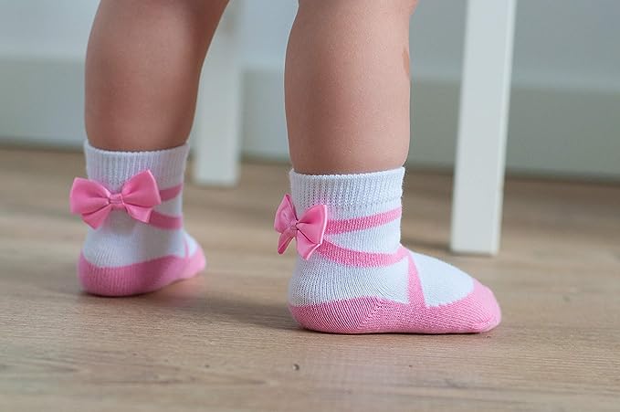 Pink ballerina baby girl socks 0-12 months with satin bows and non-slip grippers