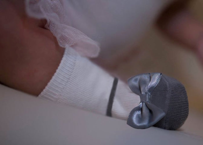 Grey festive socks that look like shoes by Baby Emporio, with non-slip grippers and grey satin bows