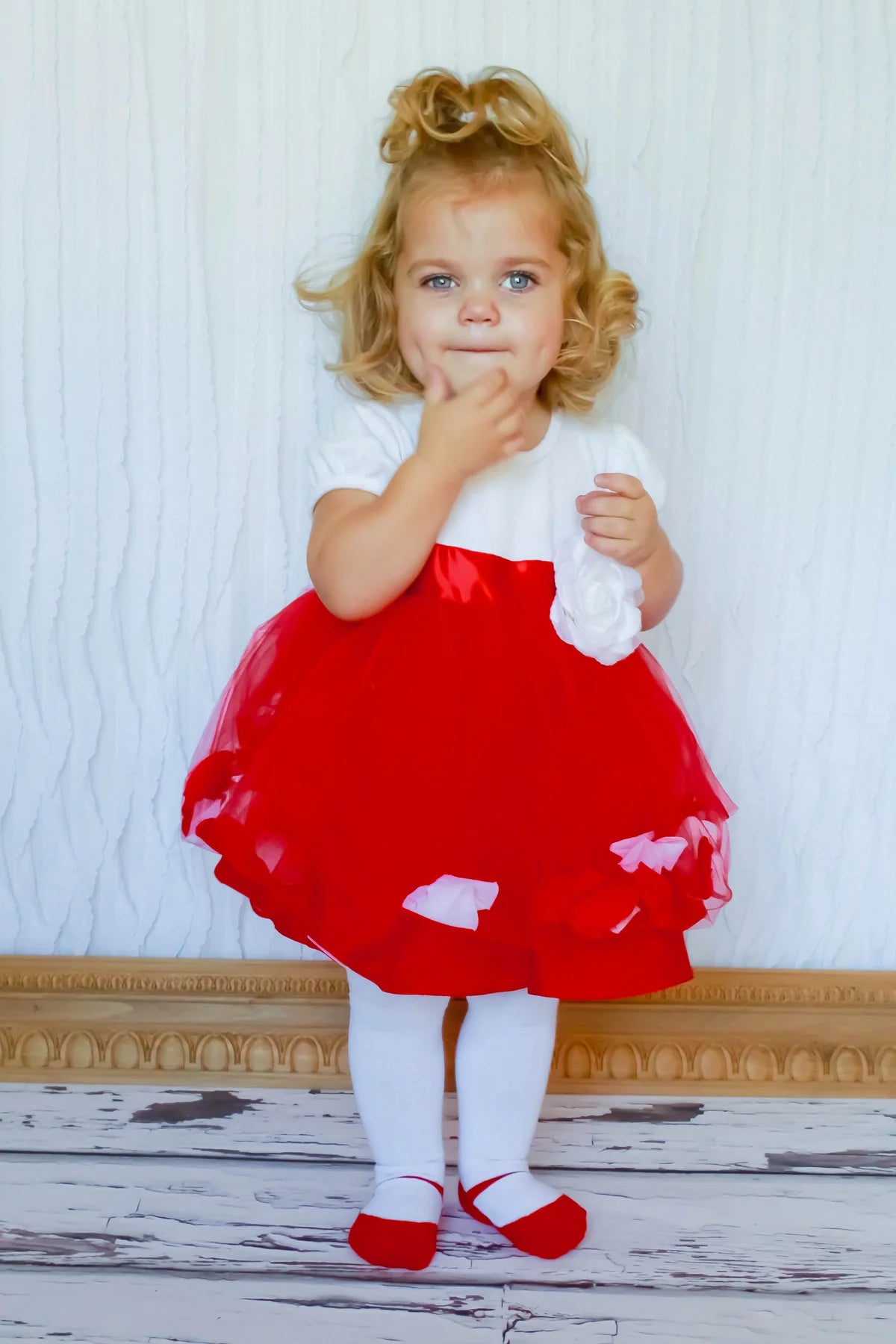 Little girl wearing red holiday dress with red Baby Emporio shoe look tights with anti-slip soles size 0-6 months