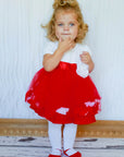 Little girl wearing red holiday dress with red Baby Emporio shoe look tights with anti-slip soles size 0-6 months