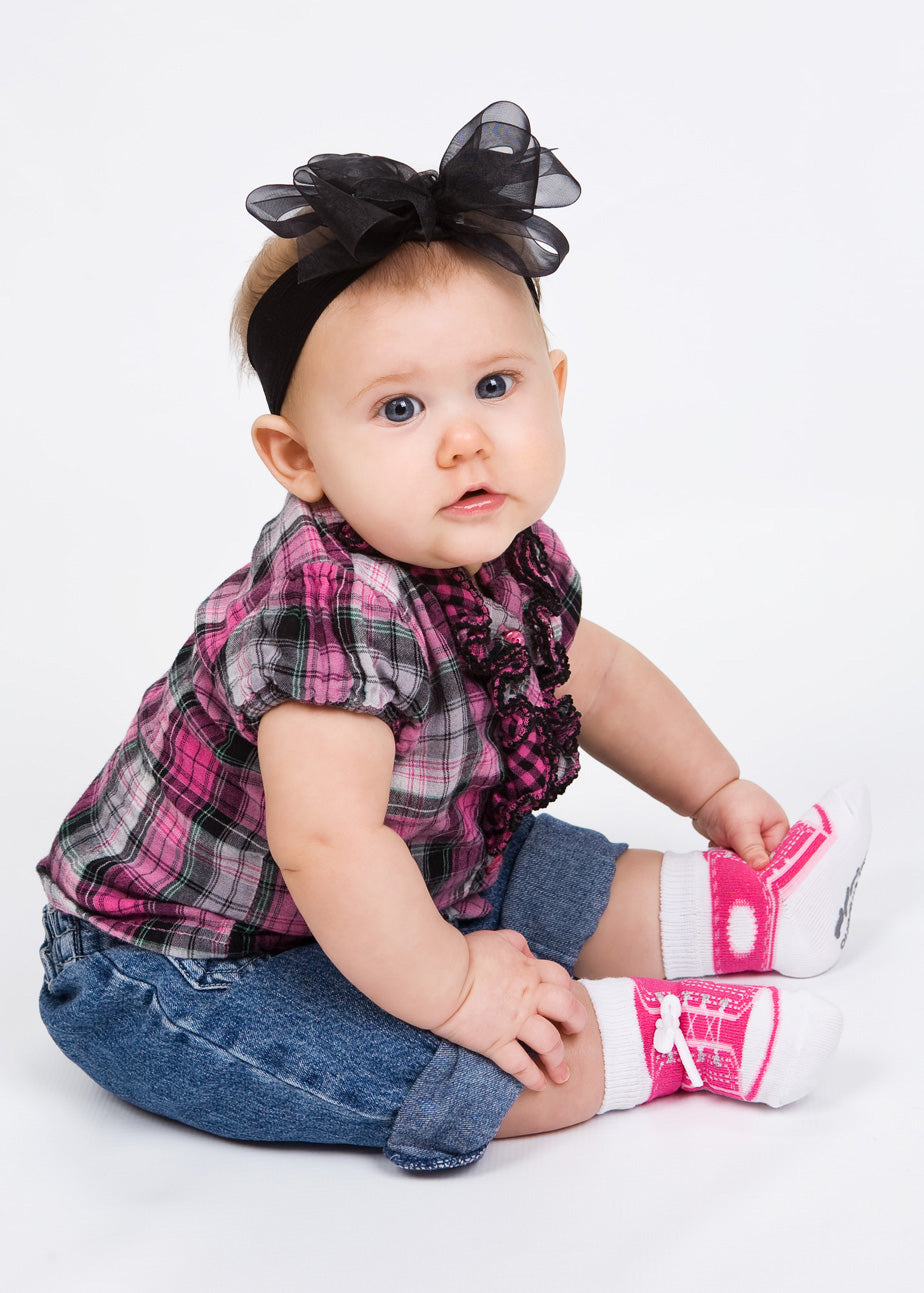 Baby girl sporty sneaker socks that look like real shoes with faux laces and non-slip gripper soles