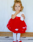 Toddler girl wearing white cotton tights with red shoe look design for Christmas or Valentine's Day